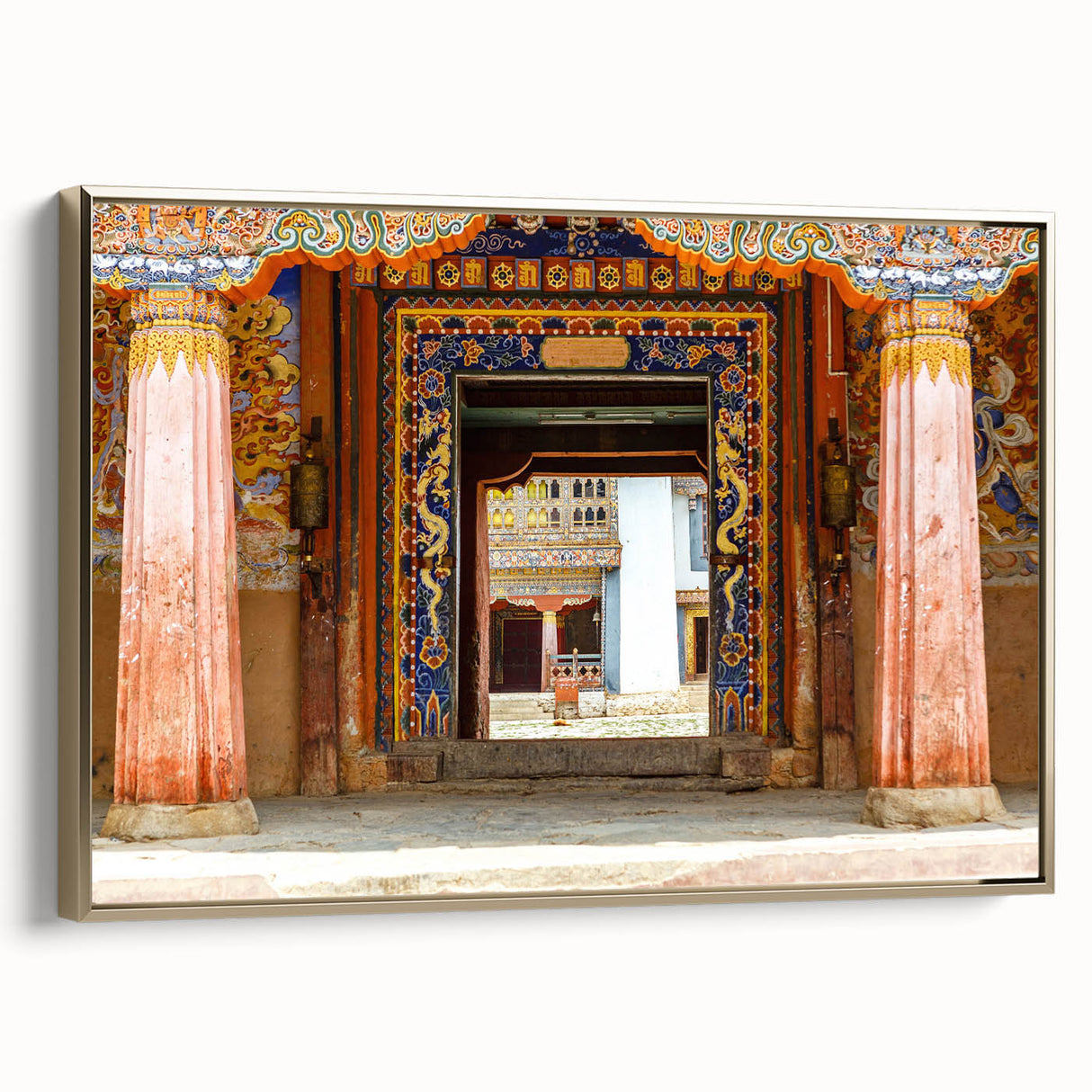 Framed canvas of a Bhutanese landscape with vintage poster style, featuring black and gold tones, ideal for bedroom wall art.