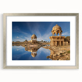 Textured abstract art print depicting a serene Indian landscape in earthy tones, framed in silver, ideal for bedroom decor.