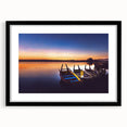 Colorful abstract art print of a textured Asian landscape in vibrant hues, framed in black, ideal for living room decor.