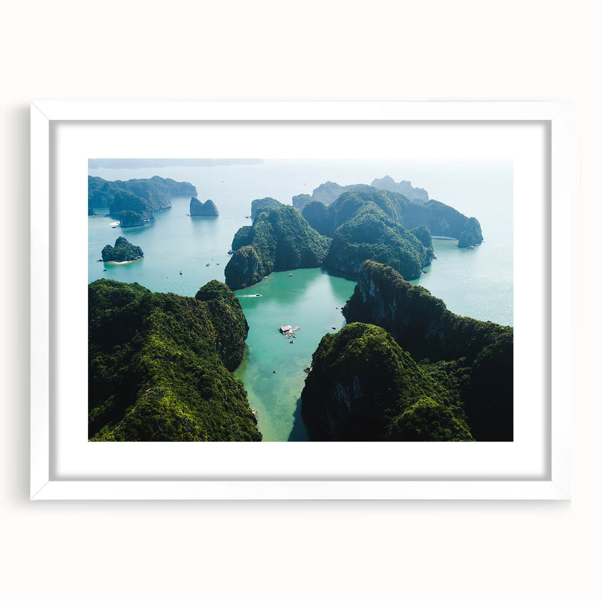 Abstract art print of a Vietnamese landscape in muted green and blue tones on a framed white mat.