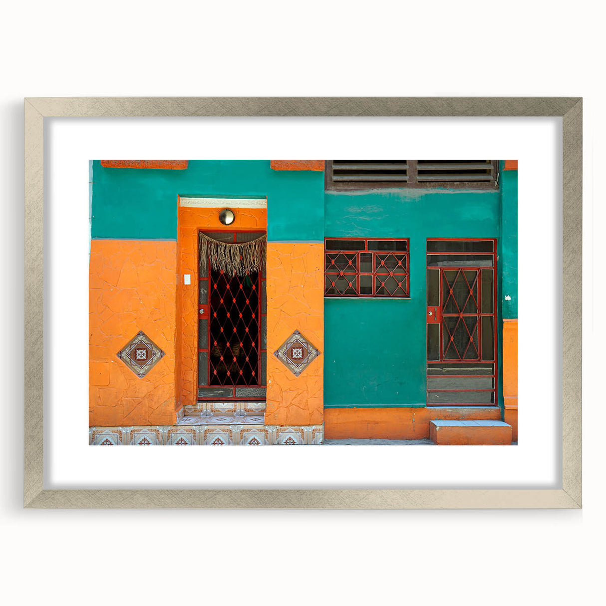 Extra large abstract art print of Caribbean scenery in muted blue and green tones, framed with a silver mat.