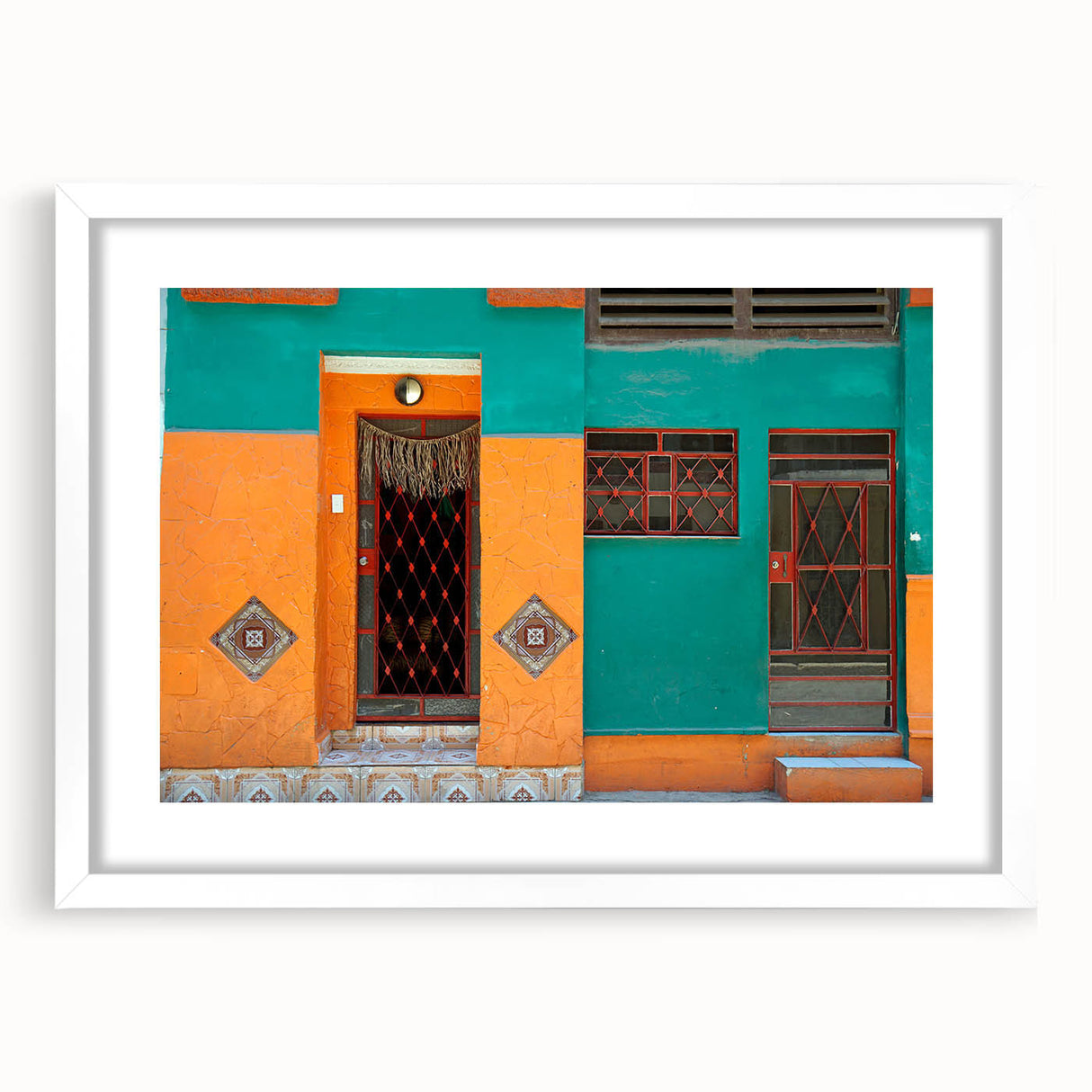 Textured abstract art print depicting a Caribbean scene in vibrant blue and green tones, framed with a white mat.