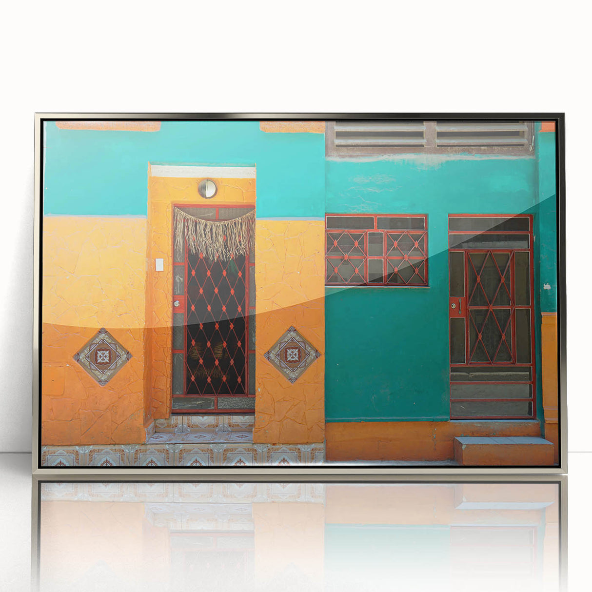 Mid-century modernist art of a Caribbean scenery in silver-framed acrylic, featuring vibrant blue and green tones.