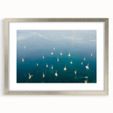 Extra large abstract art print of Caribbean scenery in muted blue and green tones on a framed canvas.