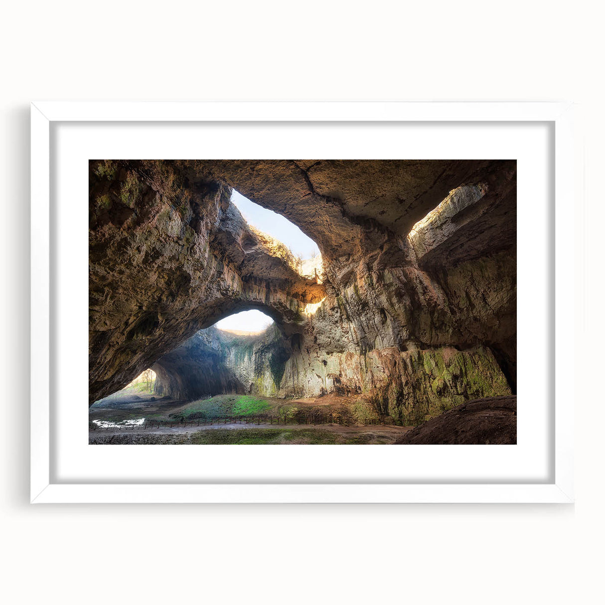 Textured abstract art print depicting a European scenery in muted earth tones on a framed white mat.