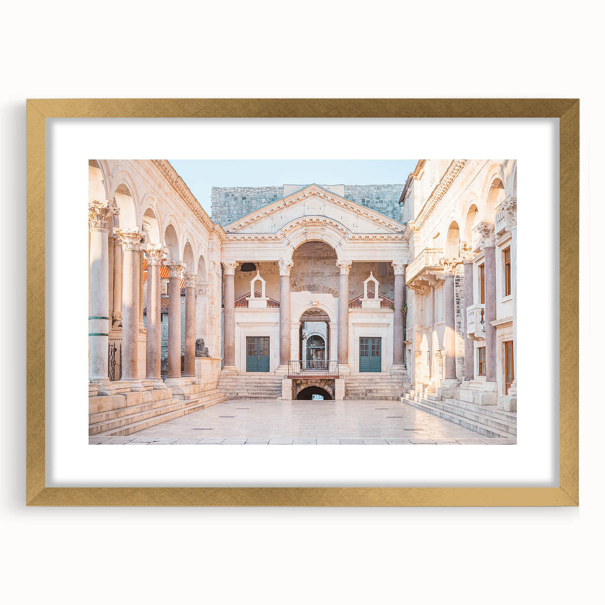 Abstract art print of a European Croatian scenery in muted earth tones, framed in gold, suitable for dining room decor.