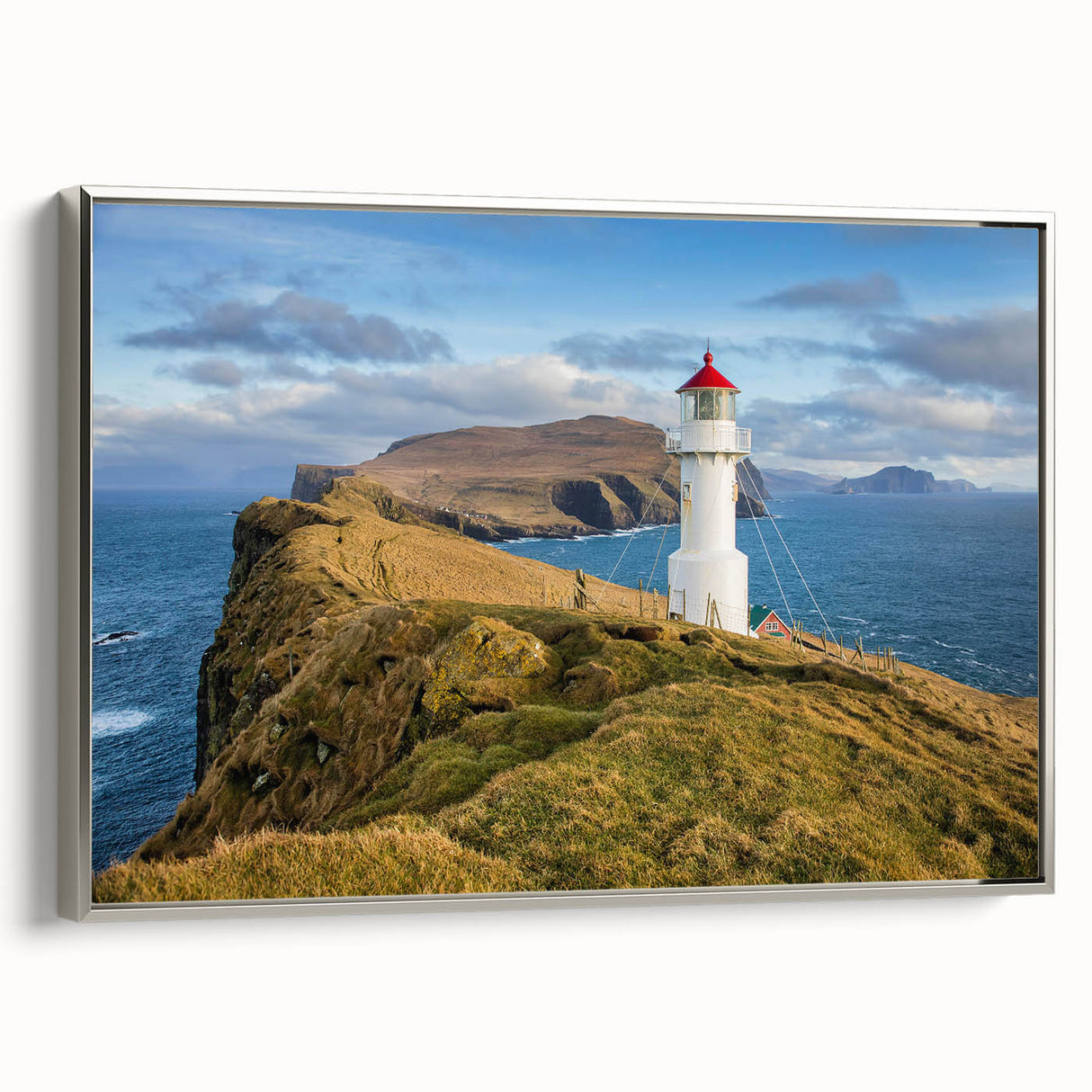 Framed canvas featuring a vintage-style landscape painting of a Danish scenery, with colorful art on a black background.