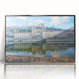 Large art print of Lyon, France, in mid-century modernist style on silver-framed acrylic, with muted color tones.