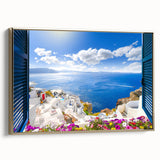 Framed canvas wall art depicting a vintage-style landscape of Santorini, Greece, in muted gold and black tones.