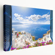 Large art print of Santorini scenery in vibrant blue and white tones on stretched canvas, ideal for kitchen wall art.