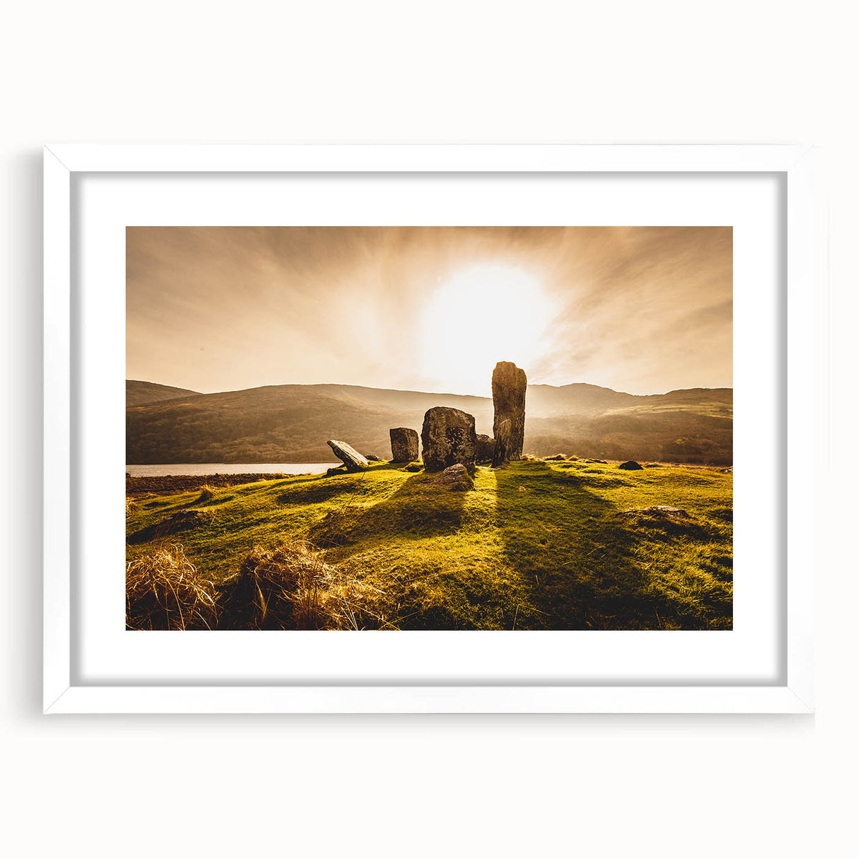 Textured art print of abstract Irish landscape in muted green and blue tones, framed with a white mat, ideal for bedroom art.