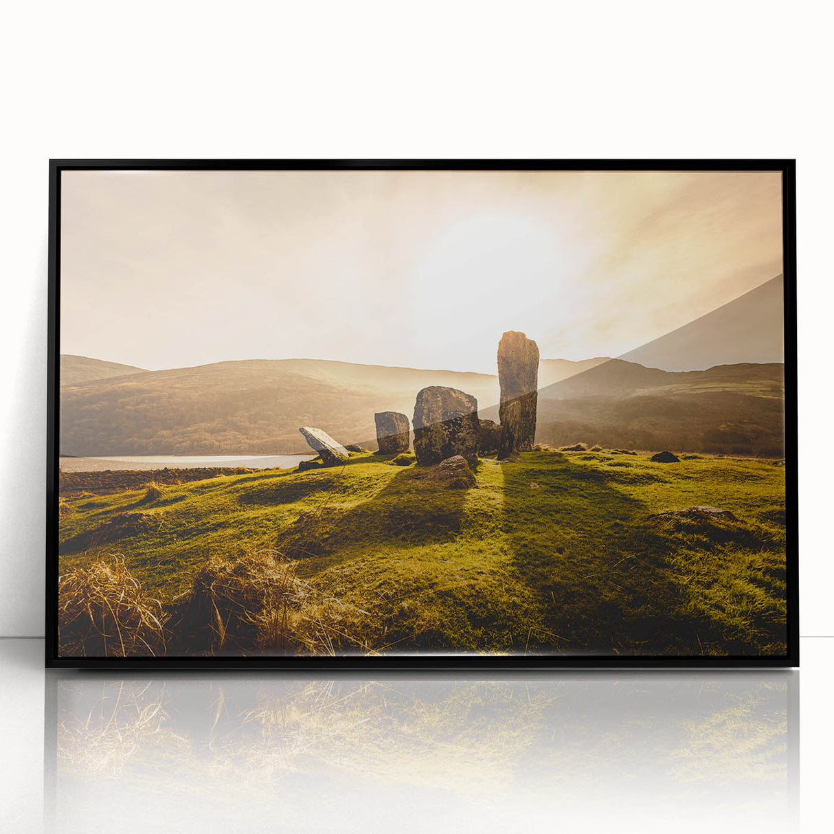 Large abstract wall art depicting a serene Irish landscape in muted green and blue tones, framed in black acrylic.