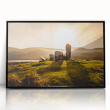 Large abstract wall art depicting a serene Irish landscape in muted green and blue tones, framed in black acrylic.