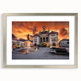 Extra large abstract art print of a textured European landscape in muted earth tones, framed in silver.