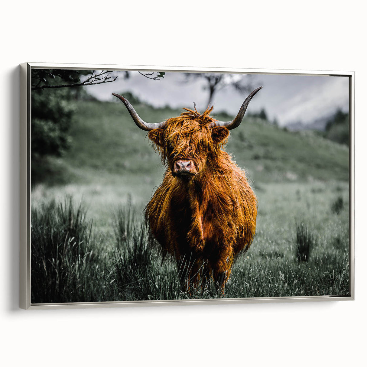 Framed canvas featuring a vintage-style landscape painting of a Scottish scenery in muted earth tones.