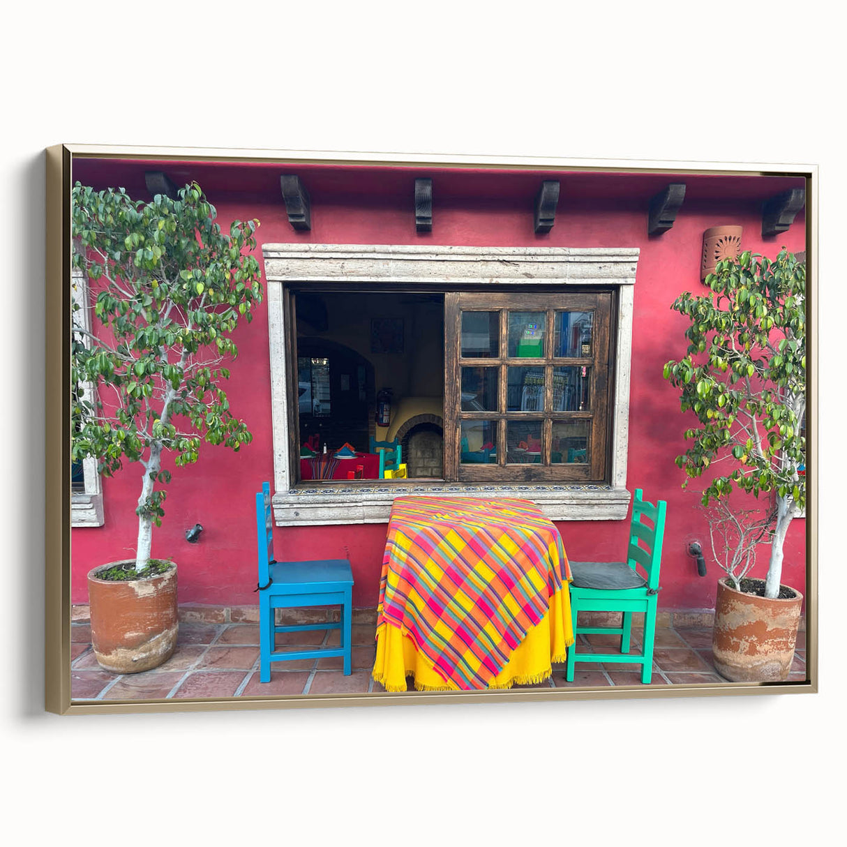 Framed canvas wall art of Cabo San Lucas landscape in muted gold tones, ideal for bedroom decor.