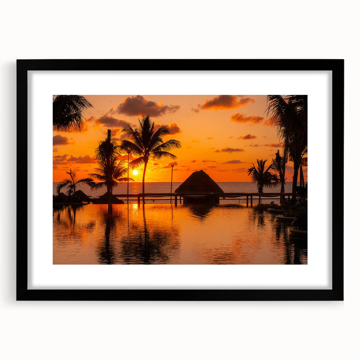 Abstract art print of Cancun scenery in vibrant colors, textured on a large black-framed canvas.