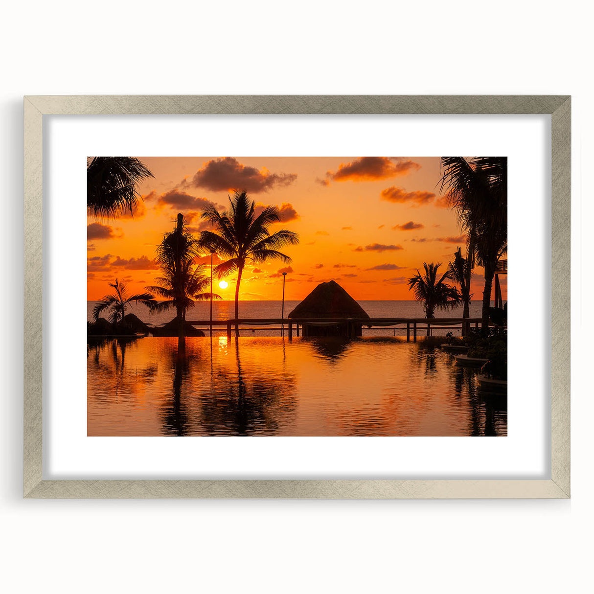 Textured abstract art print of Cancun scenery in muted blue and green tones, framed in silver, ideal for bedroom art.