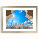 Textured abstract art print of Abu Dhabi skyline in muted silver and gray tones on a framed canvas.