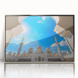 Mid-century modernist art of Abu Dhabi skyline in silver framed acrylic, featuring muted blue and gray tones.