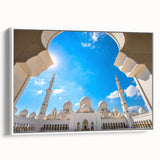 Vintage poster art of Abu Dhabi scenery on a framed canvas, featuring colorful art with black accents.