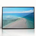 Large abstract wall art depicting an oceanic Fiji scenery in muted blue and green hues, framed in black acrylic.