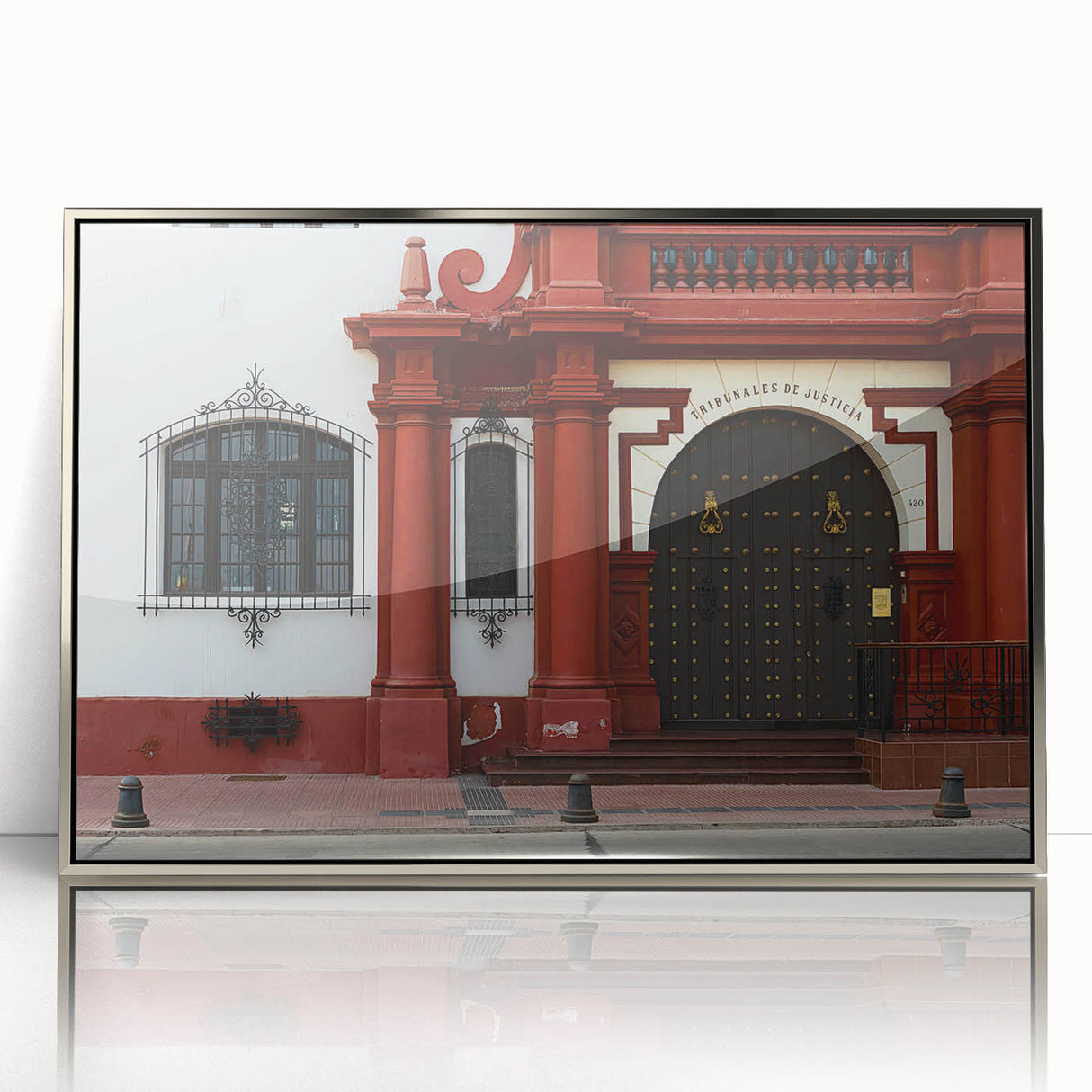 Mid-century modernist art depicting Santiago, Chile skyline in muted earth tones on a silver-framed acrylic print.