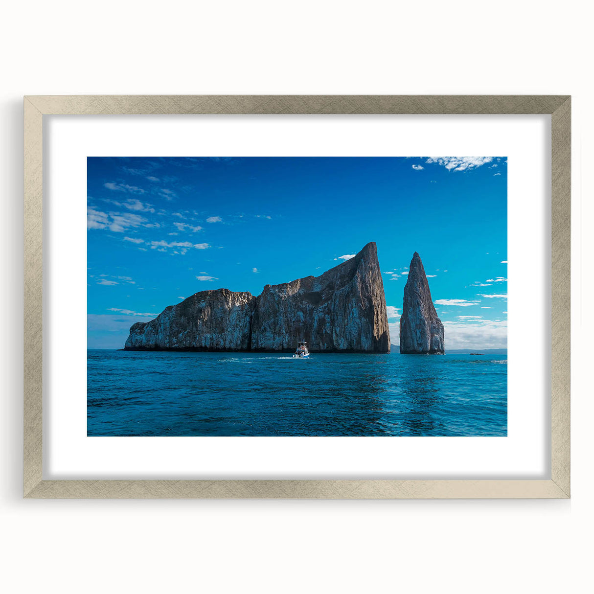 Textured abstract art print of Galapagos scenery in muted earth tones on a silver-framed canvas, ideal for bedroom art.