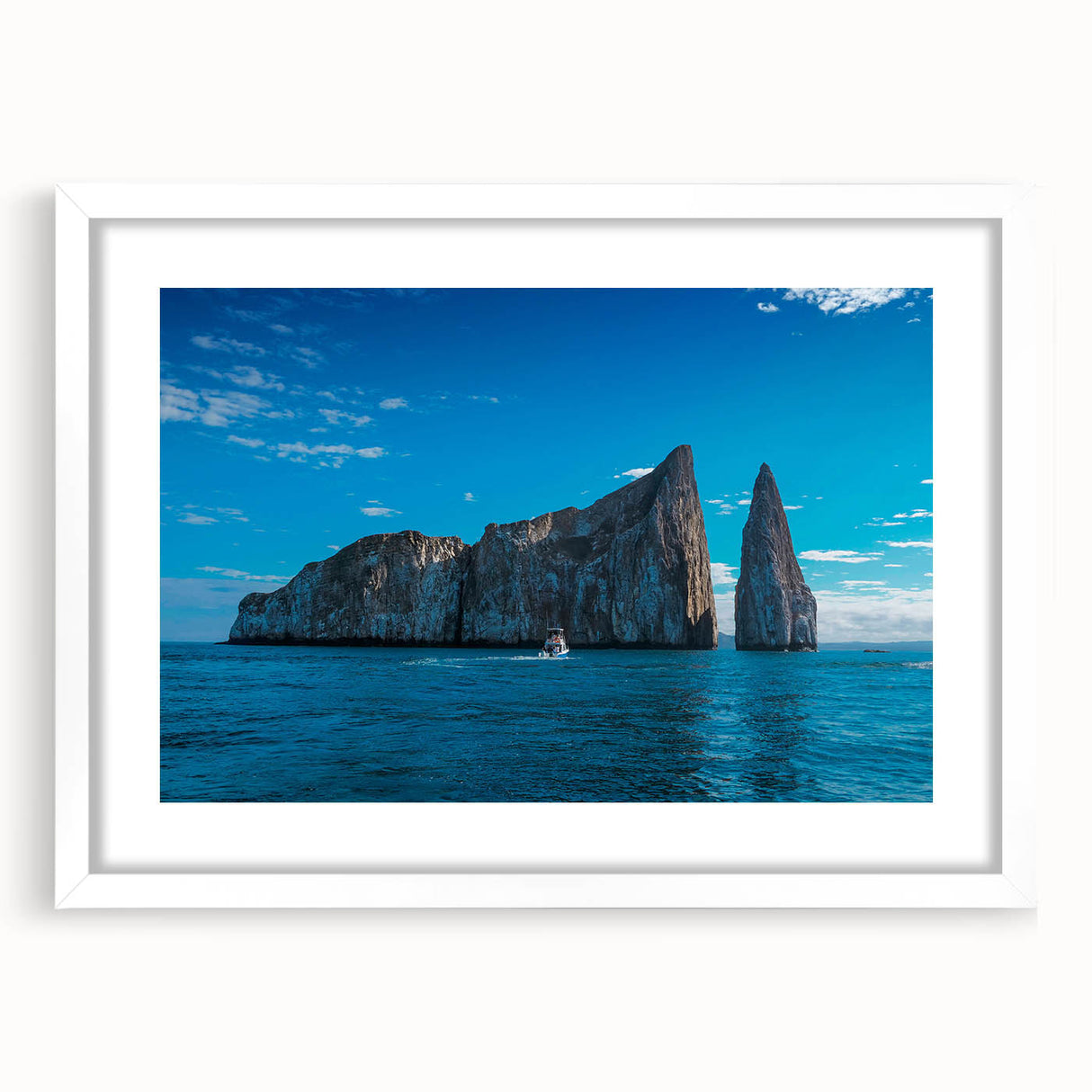 Abstract art print of Galapagos scenery in muted earth tones on a framed white mat, ideal for bedroom or dining room decor.