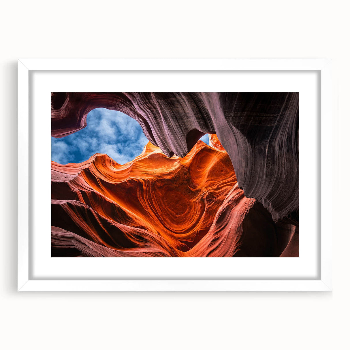 Abstract art print of Arizona's Antelope Canyon in muted orange and brown tones on a framed white mat.