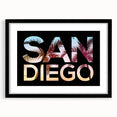 Colorful abstract art print of San Diego scenery in vibrant hues on a large textured canvas, framed in black.