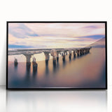 Large abstract wall art depicting the Maui coastline in vibrant blues and greens, framed in black acrylic.