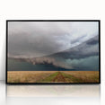Large abstract wall art featuring swirling patterns in muted earth tones, framed in black acrylic.