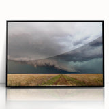 Large abstract wall art featuring swirling patterns in muted earth tones, framed in black acrylic.