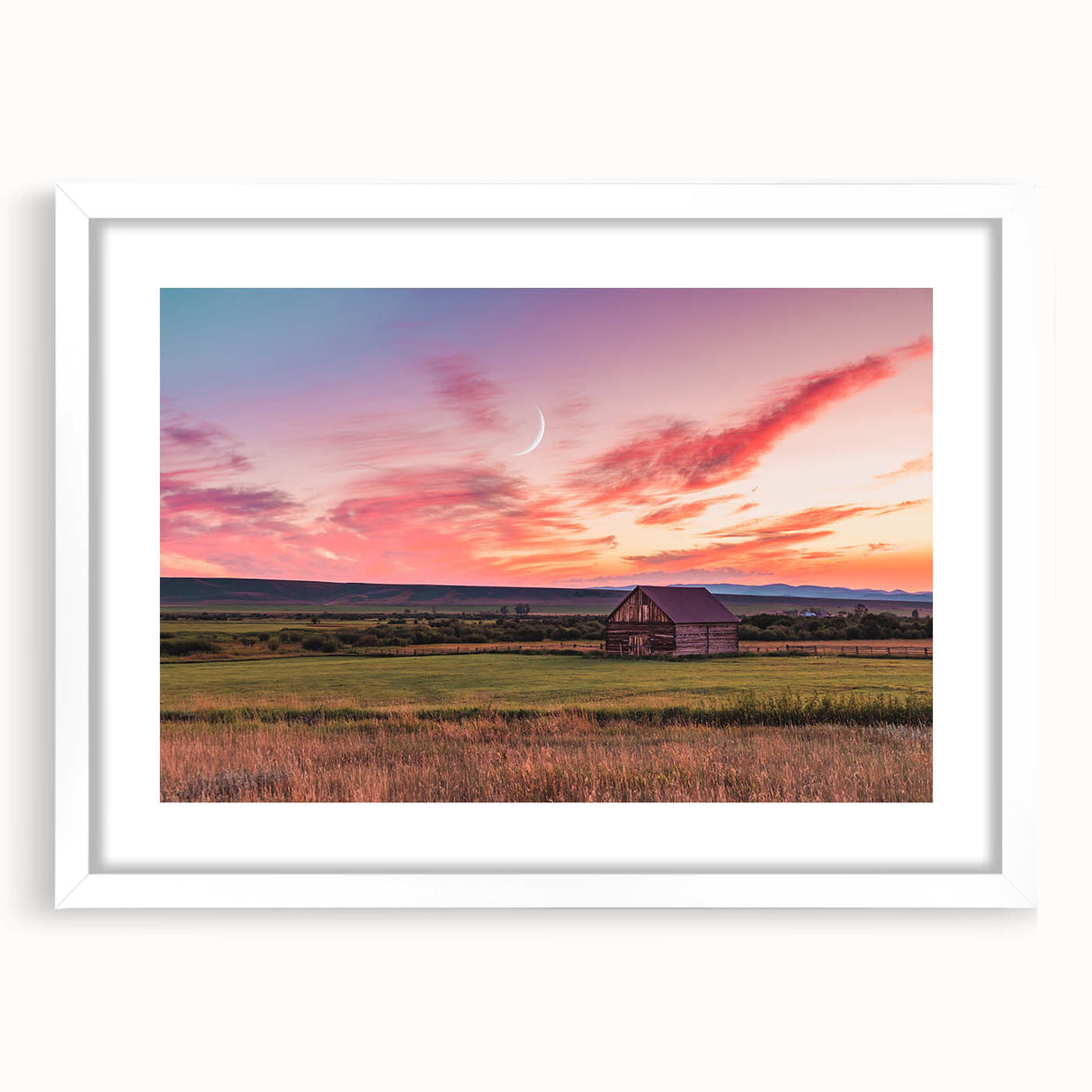 Abstract art print of Montana scenery in muted earth tones on a white matted frame, suitable for dining room decor.
