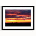 Extra large abstract art print of colorful, textured Charlotte skyline on a framed black mat, ideal for living room decor.