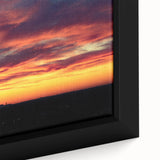 Textured black wall art of Charlotte skyline with colorful accents on a framed canvas, ideal for living room decor.