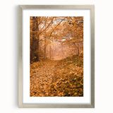 Textured abstract art print in warm autumn tones, framed in silver, ideal for bedroom ambiance.