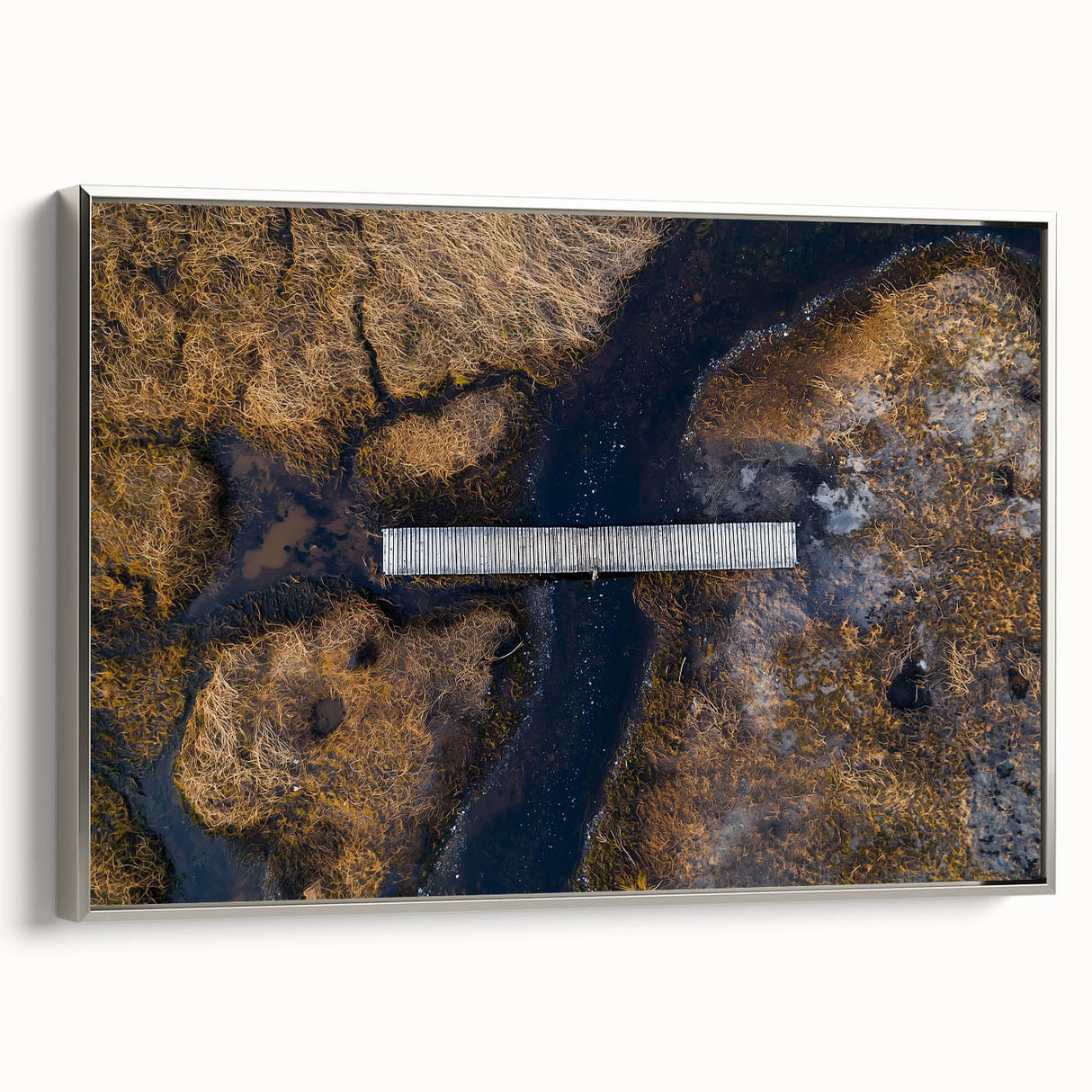 Framed canvas artwork showcasing a serene landscape bridge in silver tones, elegantly displayed from a side view, perfect for enhancing modern home decor.