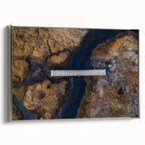 Framed canvas artwork showcasing a serene landscape bridge in silver tones, elegantly displayed from a side view, perfect for enhancing modern home decor.