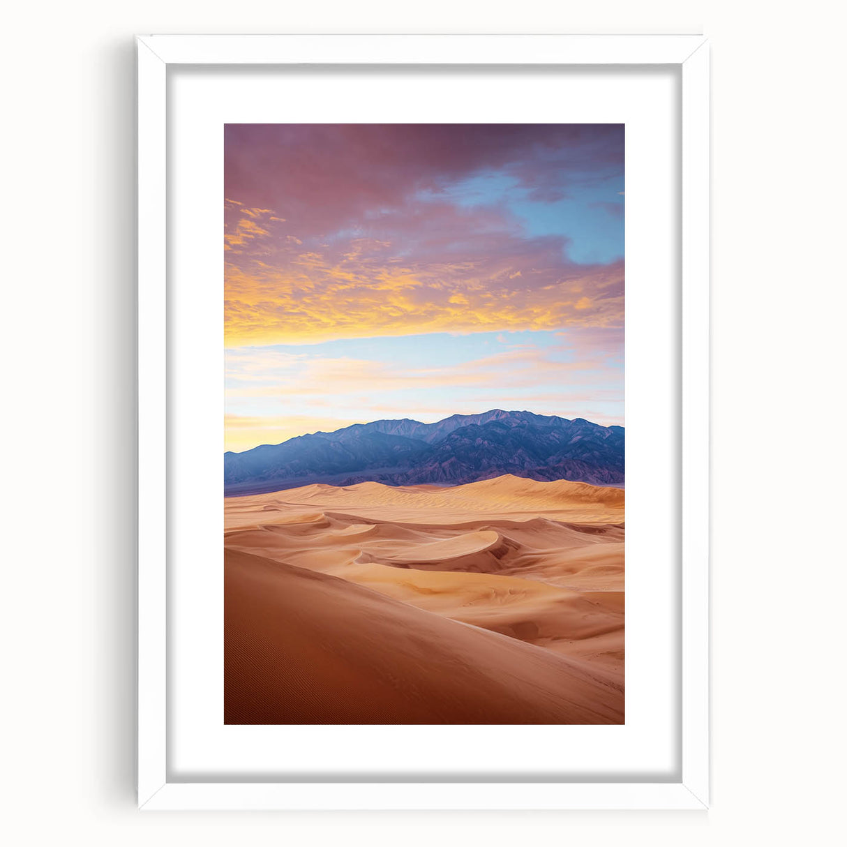 Framed landscape artwork depicting serene sand dunes under a bright blue sky, enclosed in a white mat and sleek black frame, ideal for modern home decor.