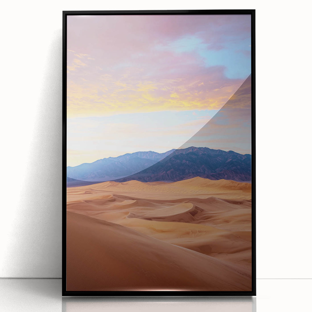 Framed acrylic artwork depicting serene desert dunes in warm tones, showcased in a sleek black frame, perfect for modern home decor and landscape enthusiasts.