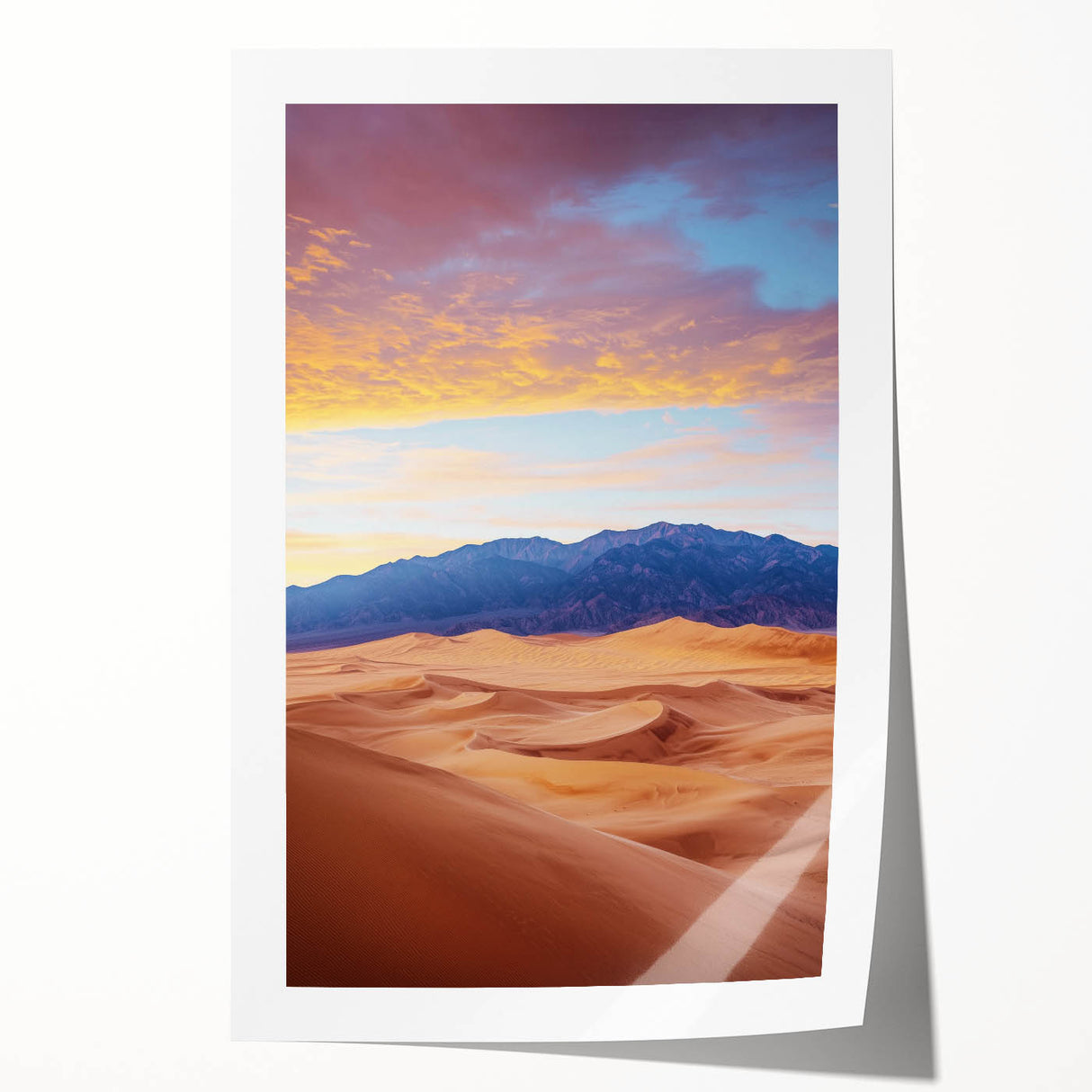 Rolled print of a serene desert landscape showcasing golden sand dunes under a clear blue sky, elegantly packaged in a protective cardboard tube for easy shipping.