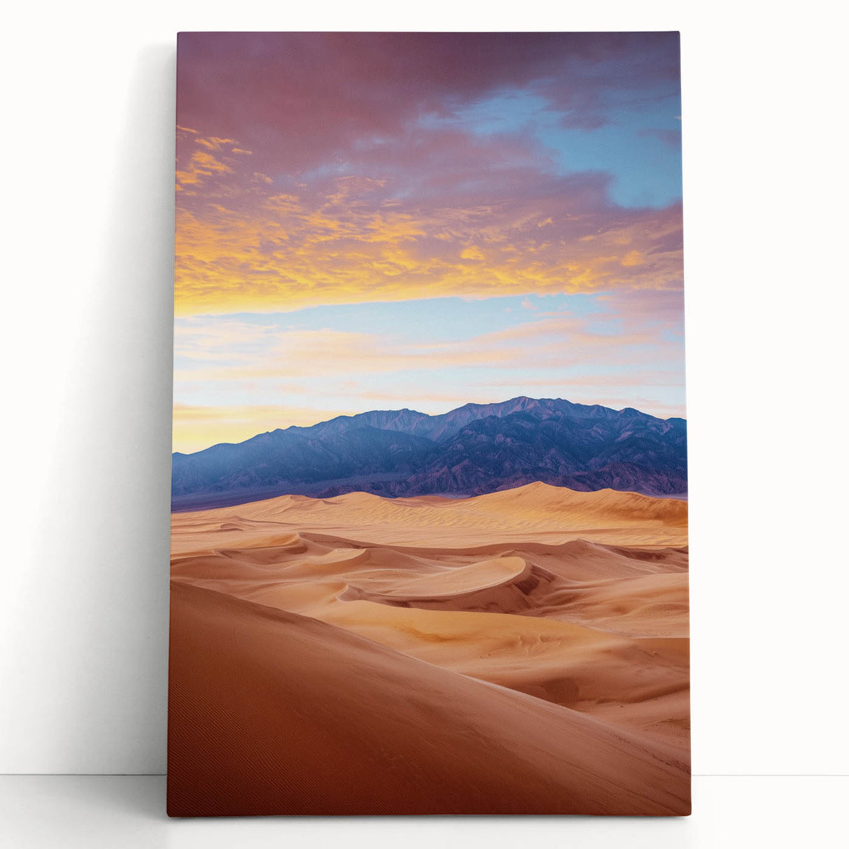 Stretched canvas artwork depicting serene sand dunes under a vibrant sunset, featuring warm hues of orange and yellow, perfect for enhancing home decor.