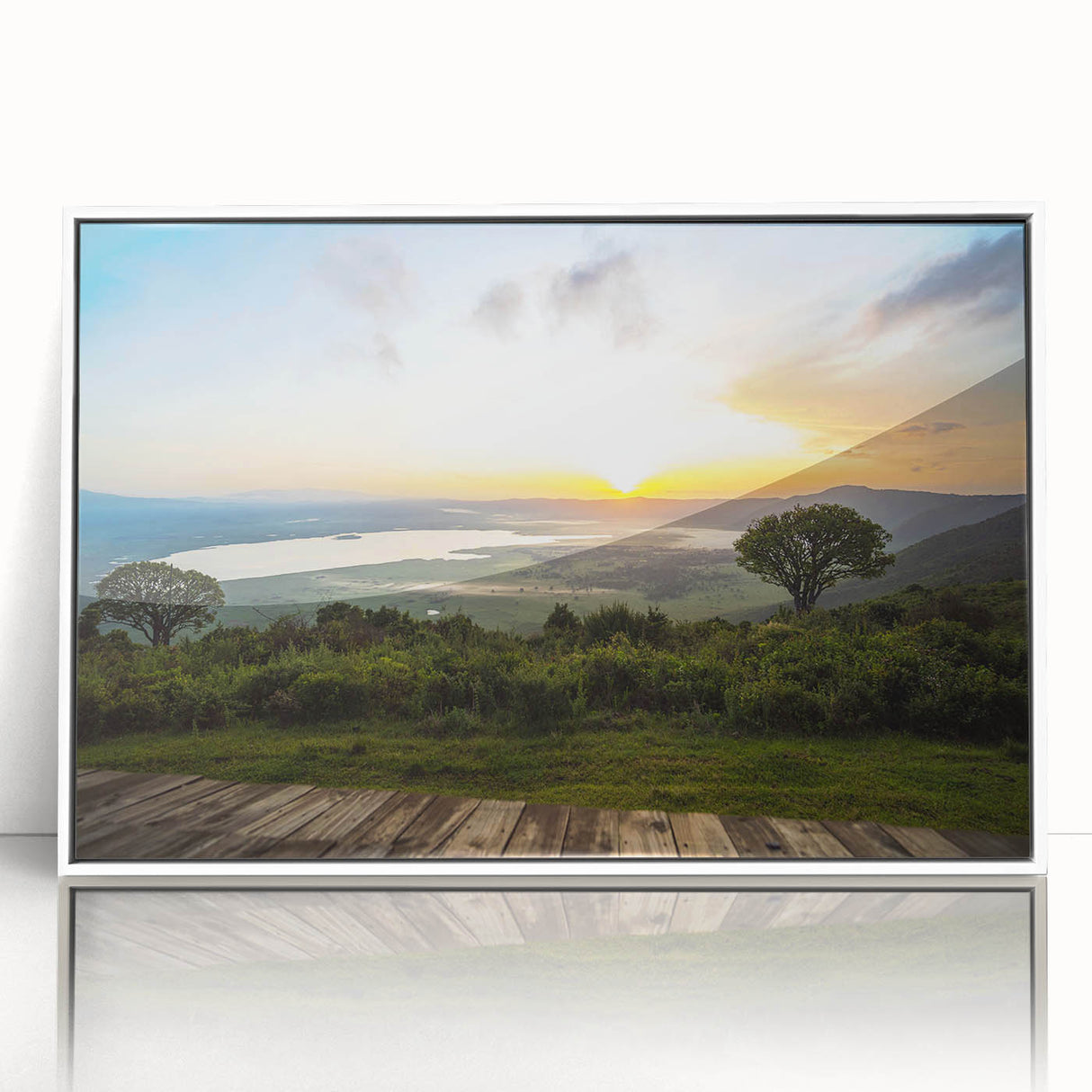 Acrylic print of a Tanzanian landscape with vibrant greens and blues, framed in white, suitable for modern art wall decor.