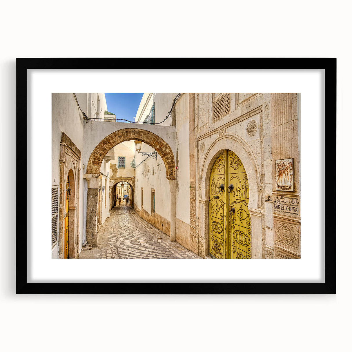 Extra large abstract art print of colorful, textured scenery of Tunisia on a black framed canvas.