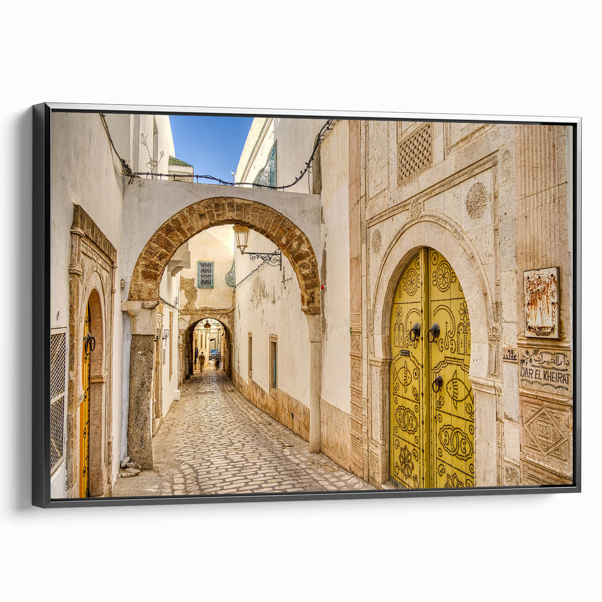 Framed canvas of a black and white Tunisian landscape, ideal for bedroom wall art.