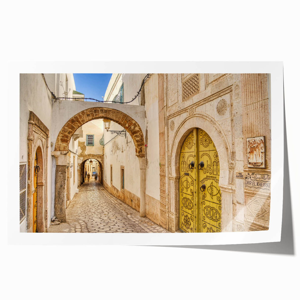 Extra large rolled print of a Tunisian landscape with vibrant floral elements, ideal for art wall dining room.