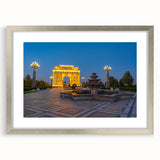 Textured art depicting abstract scenery in muted earth tones on a silver-framed mat, suitable for bedroom decor.