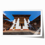 Extra large rolled print of a Bhutanese landscape featuring lush greenery and traditional architecture.